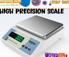 Laboratory precision balance with zero adjustment knob